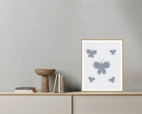 Platinum Silver Butterfly Wall Art Print – Signed Limited Edition Giclée | Modern Gallery Decor — Grey wall with bowl